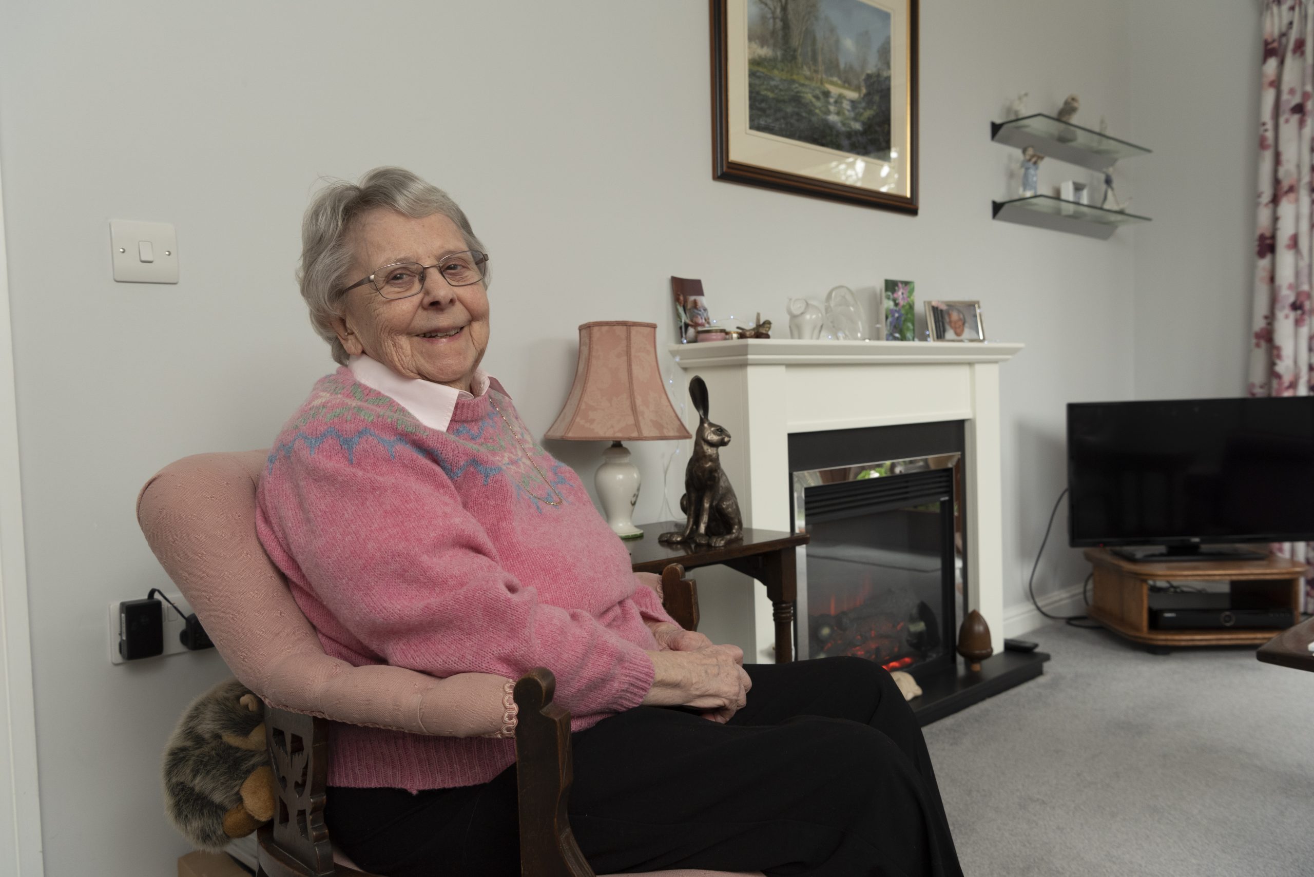 Extra Care Mews resident smiling in apartment