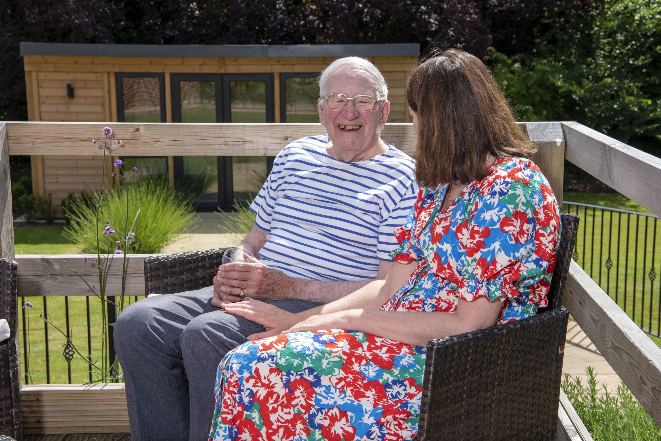 Resident chatting with volunteer in garden