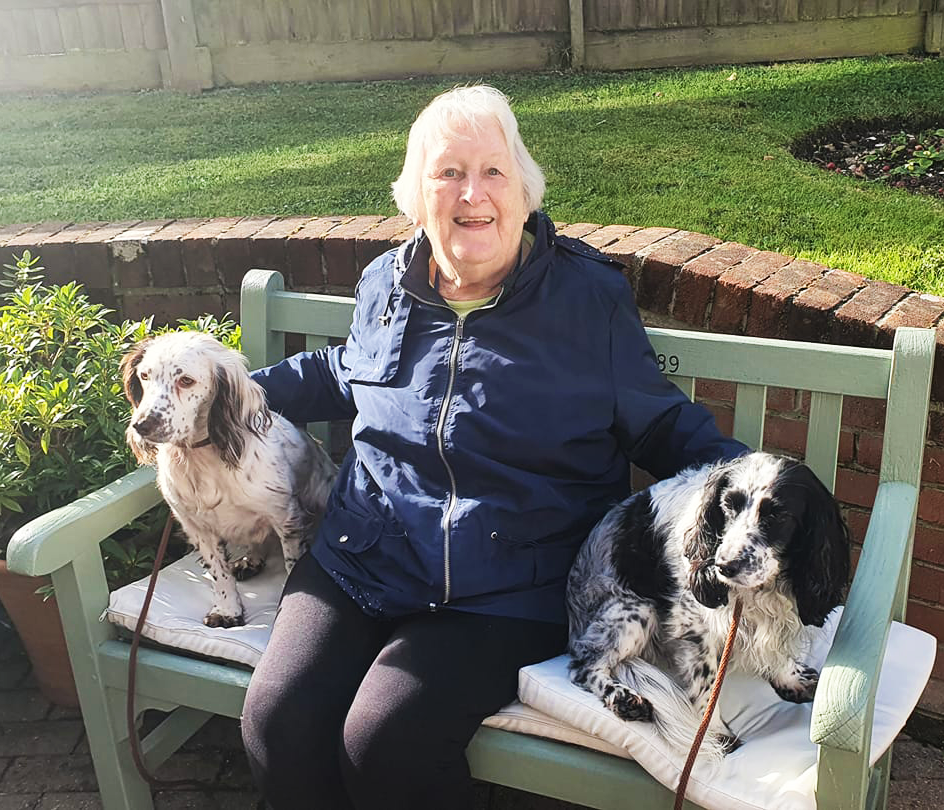 Meadway resident with dogs in garden